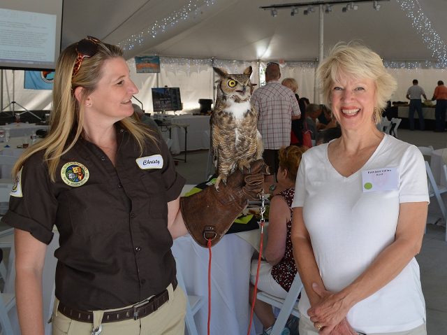 Christy McGiveron and Kathy Callan with Cowboy the great horned owl from the Big Bear Alpine Zoo