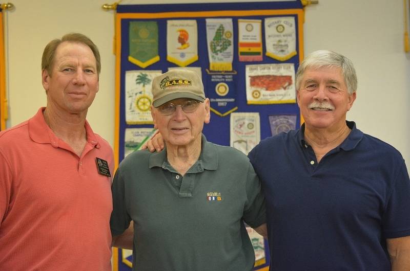 Red Bluff Rotary President Tom Amundson; his father, Roy; and author Steven T. Callan