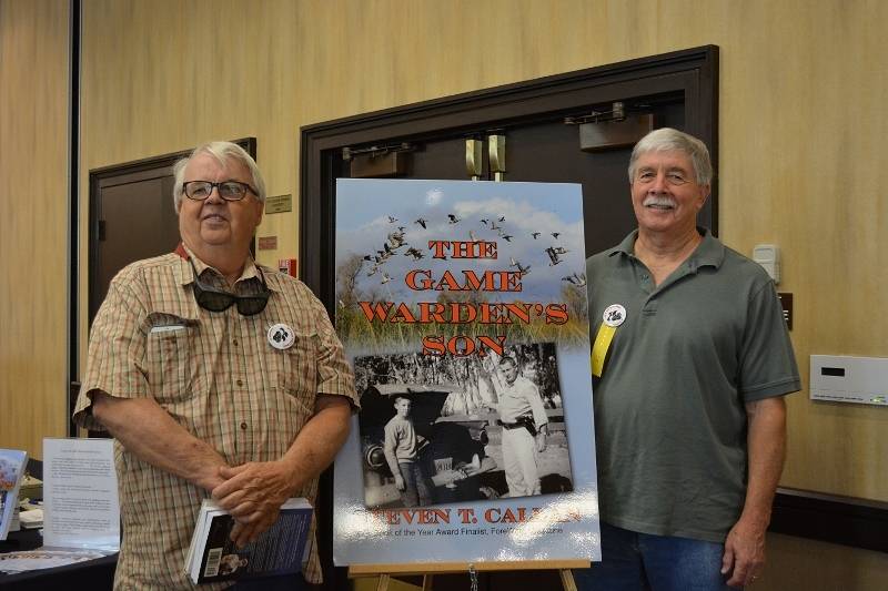 Author Steven T. Callan and friend at a book signing for The Game Warden's Son at the Pacific Flyway Decoy Association Wildfowl Art Festival