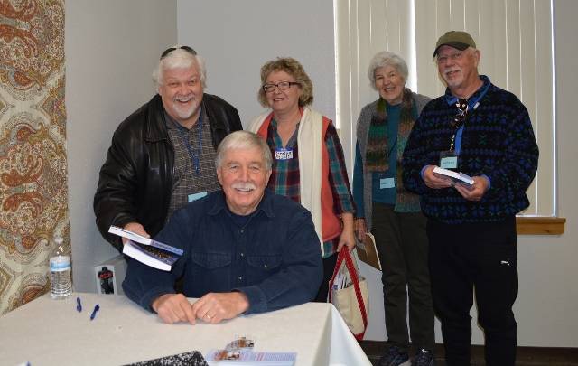 Author Steven T. Callan signs copies of his book The Game Warden's Son for members of Redding Writers Forum.