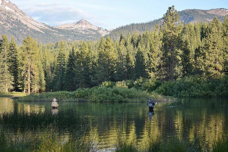 National parks provide recreation as well as inspiration: fly fishers at Manzanita Lake in Lassen Volcanic National Park. Photo by Kathy Callan.