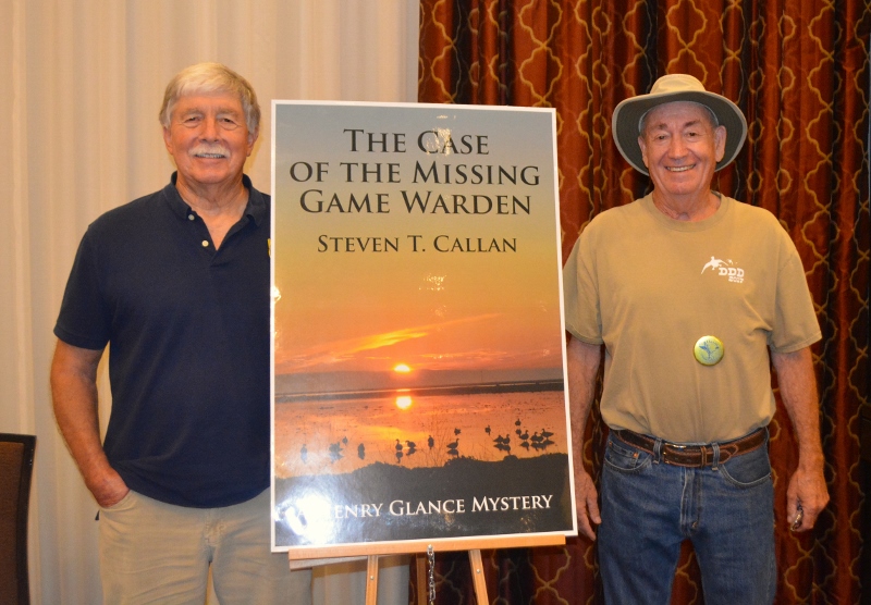 Author Steven T. Callan poses with friend at book signing for his award-winning novel ,The Case of the Missing Game Warden
