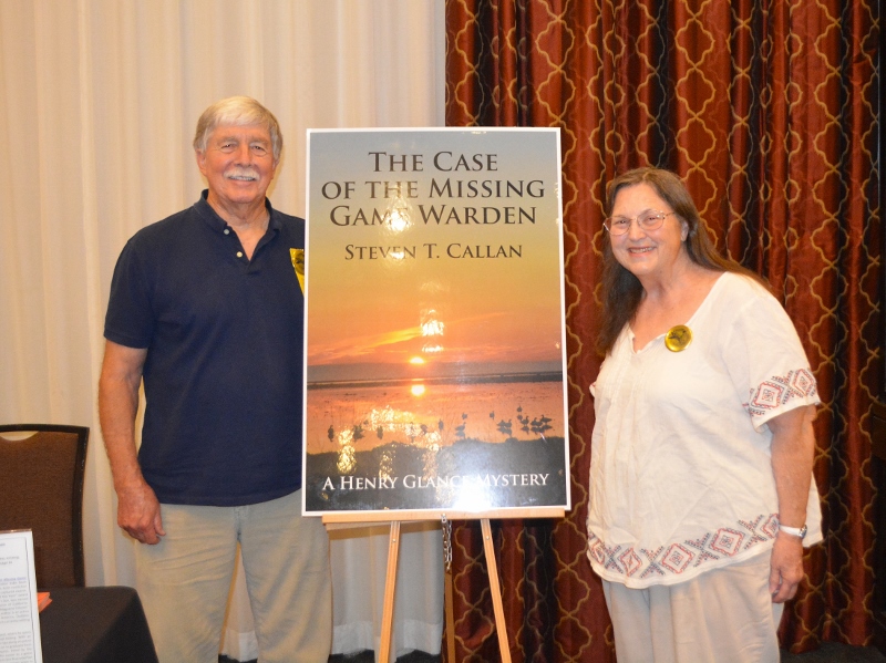 Author Steven T. Callan poses with friend at book signing for his award-winning novel ,The Case of the Missing Game Warden