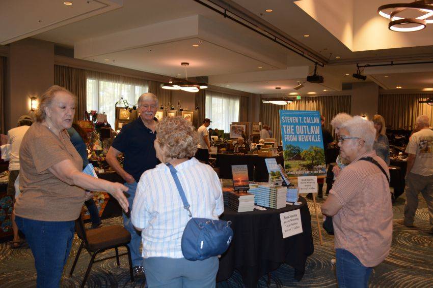 Author Steven T. Callan and friends at a book signing celebrating the release of The Outlaw from Newville, his second novel in the Game Warden Henry Glance series, at the Pacific Flyway Decoy Association Wildfowl Classic