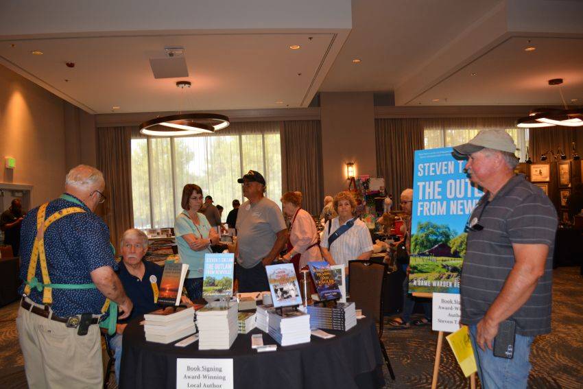Author Steven T. Callan and friends at a book signing celebrating the release of The Outlaw from Newville, his second novel in the Game Warden Henry Glance series, at the Pacific Flyway Decoy Association Wildfowl Classic