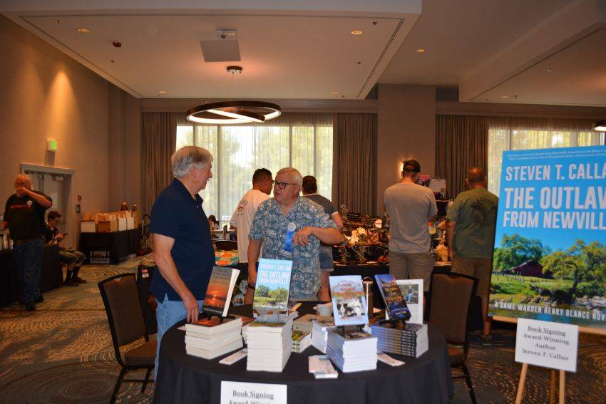 Author Steven T. Callan and friends at a book signing celebrating the release of The Outlaw from Newville, his second novel in the Game Warden Henry Glance series, at the Pacific Flyway Decoy Association Wildfowl Classic
