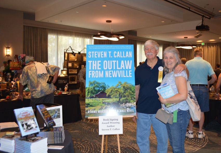 Author Steven T. Callan and friend at a book signing celebrating the release of The Outlaw from Newville, his second novel in the Game Warden Henry Glance series, at the Pacific Flyway Decoy Association Wildfowl Classic