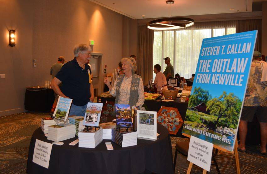 Author Steven T. Callan and friend at a book signing celebrating the release of The Outlaw from Newville, his second novel in the Game Warden Henry Glance series, at the Pacific Flyway Decoy Association Wildfowl Classic