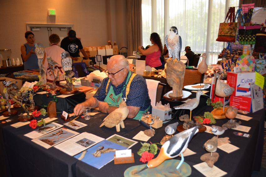 Chet Wilcox with some of his carvings at the Pacific Flyway Decoy Association Wildfowl Classic, July 12-13, 2025, at the DoubleTree Hotel, Sacramento, California