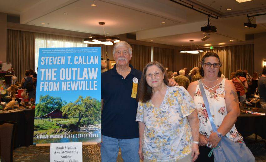 Author Steven T. Callan and friend at a book signing celebrating the release of The Outlaw from Newville, his second novel in the Game Warden Henry Glance series, at the Pacific Flyway Decoy Association Wildfowl Classic