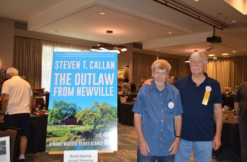 Author Steven T. Callan and friend at a book signing celebrating the release of The Outlaw from Newville, his second novel in the Game Warden Henry Glance series, at the Pacific Flyway Decoy Association Wildfowl Classic