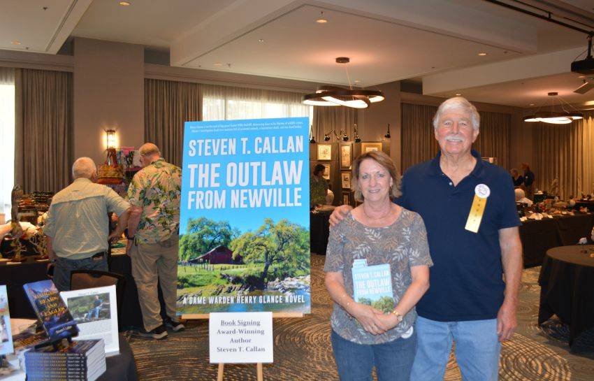 Author Steven T. Callan and friend at a book signing celebrating the release of The Outlaw from Newville, his second novel in the Game Warden Henry Glance series, at the Pacific Flyway Decoy Association Wildfowl Classic