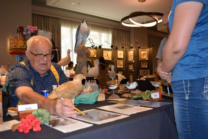 Carver Chet Wilcox discusses his osprey carving during the Pacific Flyway Decoy Association Wildfowl Classic, July 12-13, 2025, at the DoubleTree Hotel, Sacramento, California