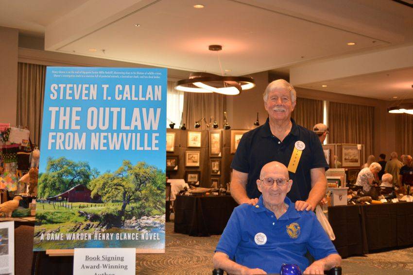 Author Steven T. Callan and friend at a book signing celebrating the release of The Outlaw from Newville, his second novel in the Game Warden Henry Glance series, at the Pacific Flyway Decoy Association Wildfowl Classic