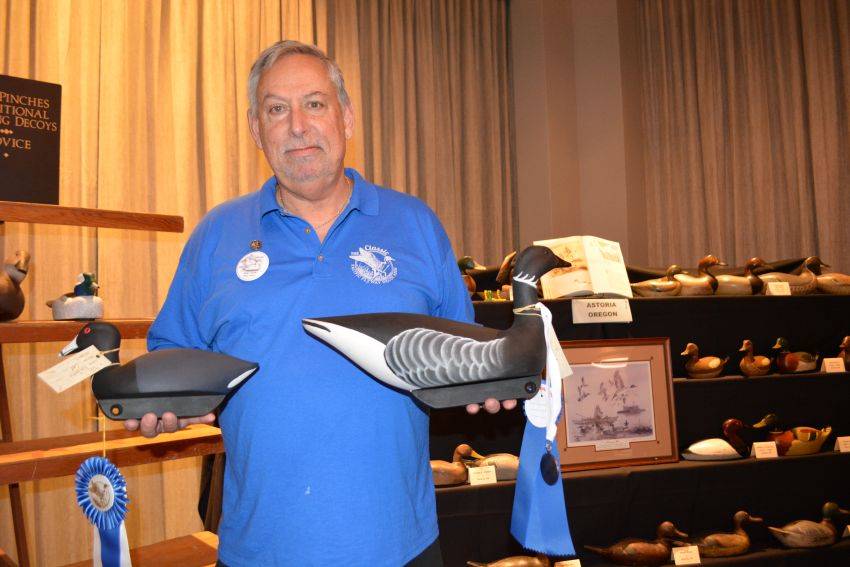 Rick Banko and his first-place American coot and black-brant decoys, at the Pacific Flyway Decoy Association Wildfowl Classic, July 12-13, 2025, at the DoubleTree Hotel, Sacramento, California
