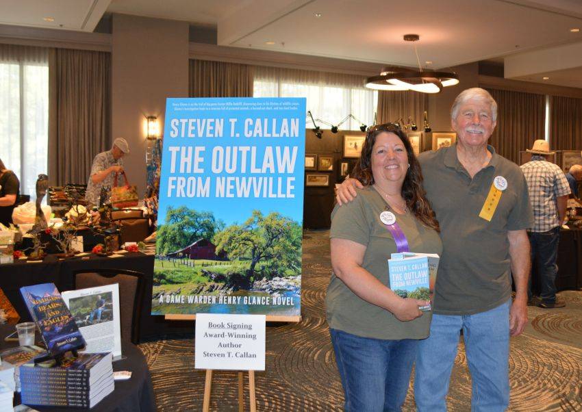 Author Steven T. Callan and friend at a book signing celebrating the release of The Outlaw from Newville, his second novel in the Game Warden Henry Glance series, at the Pacific Flyway Decoy Association Wildfowl Classic