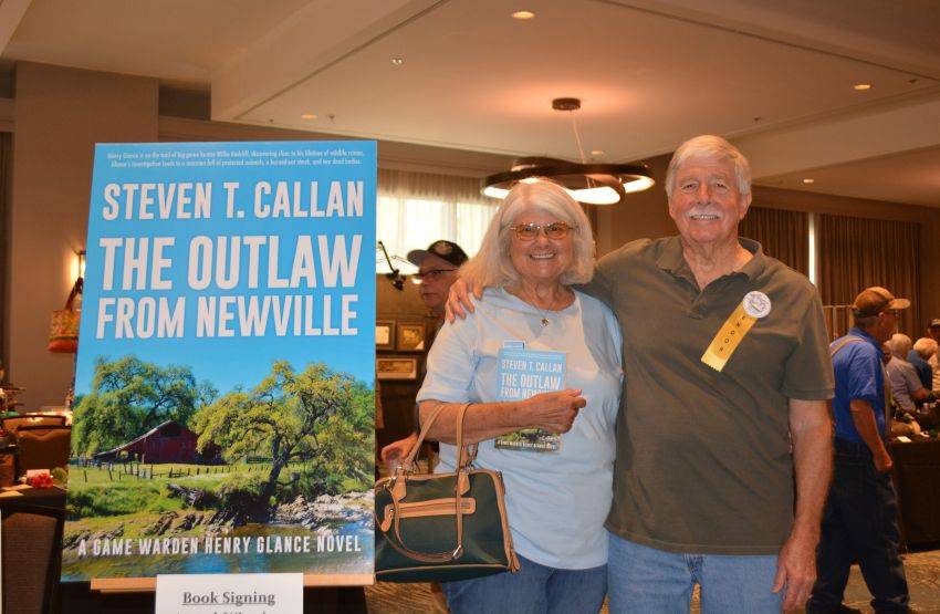 Author Steven T. Callan and friend at a book signing celebrating the release of The Outlaw from Newville, his second novel in the Game Warden Henry Glance series, at the Pacific Flyway Decoy Association Wildfowl Classic