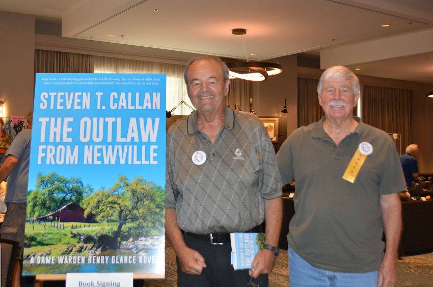 Author Steven T. Callan and friend at a book signing celebrating the release of The Outlaw from Newville, his second novel in the Game Warden Henry Glance series, at the Pacific Flyway Decoy Association Wildfowl Classic